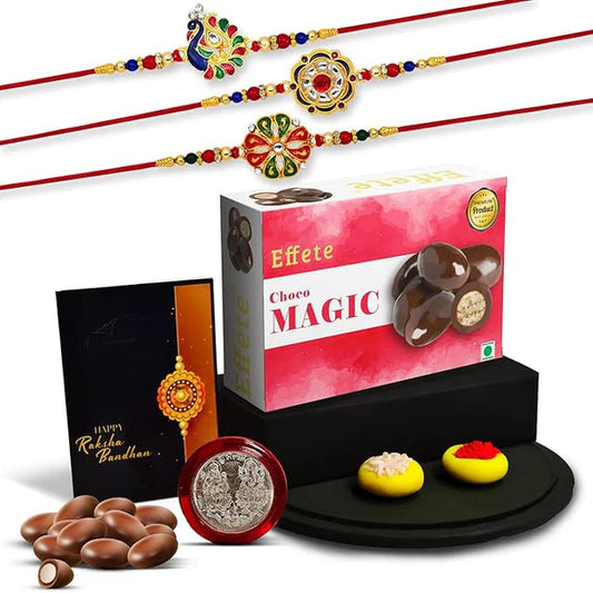 2.The Royal Heritage Rakhi Ensemble – Set of 5 Designer Peacock & Floral Rakhis with Artisanal Chocolates, Sacred Pooja Coin & Festive Tilak Essentials